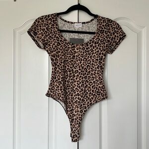 Leopard Print Bodysuit: size S, never worn, tags intact